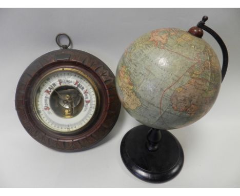 An oak cased barometer together with a small desk top terrestrial globe