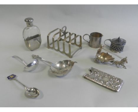 A silver four division toast rack together with a cased set of six silver teaspoons and a pair of sugar tongs, cased silver p