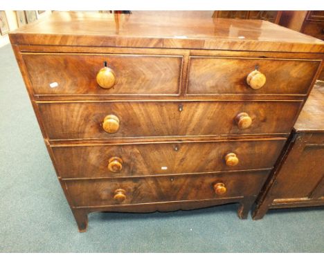 A Regency mahogany and ebony strung caddy top chest of two short and three long graduated drawers on a shaped apron and shape