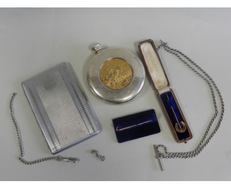 A yellow metal horseshoe pin together with a gold plated tie bar, a white metal rope twist Albert, a chromium plated cigarett