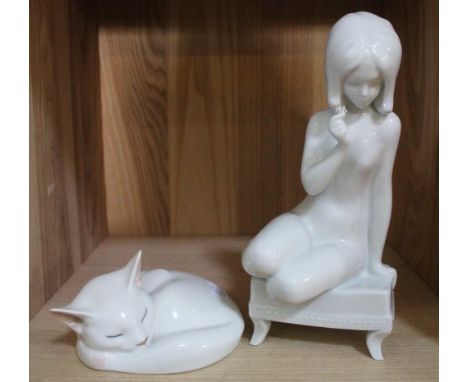 A Royal Copenhagen porcelain cat ornament, No 422, together with a Royal Dux white glaze figurine of a girl 24cm high (2)