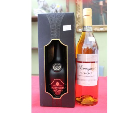 A Courvoisier De Lux Cognac in presentation box and a bottle of VSOP Armagnac