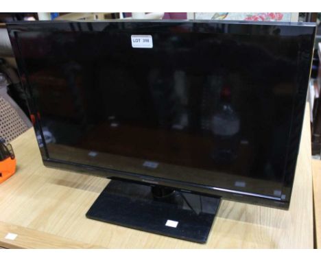 A Panasonic flat screen TV with remote