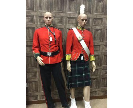 MODERN MANNEQUIN IN MILITARY DRESS, in a 19th Century crimson doublet, with kilt, Gordon Highlanders white leather cross belt