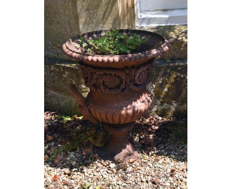 A Victorian cast iron 'Medici style' campana garden urn, late 19th century, the part-lobed body relief cast with a band of fo