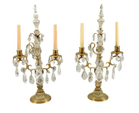 A pair of cut glass and rock crystal mounted gilt metal twin light candelabra in 18th century taste, second quarter 20th cent