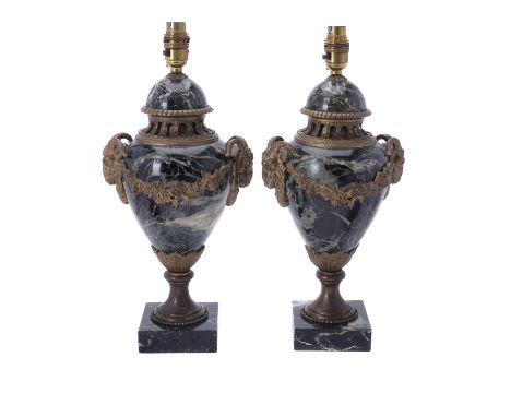 A pair of gilt metal mounted green Serpentine marble table lamps, in Louis XVI style, 20th century, of urn form, each with tw