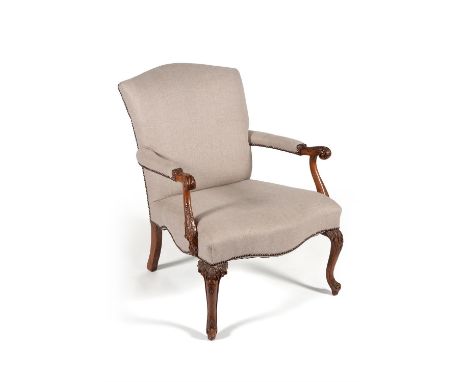 A carved beech and upholstered armchair, in eighteenth century Chippendale style, 20th century, 90cm high, 73cm wide, 86cm de