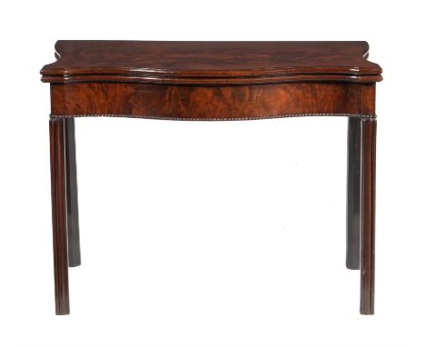 A George III mahogany tea table, circa 1780, of serpentine outline, the hinged top enclosing a baize playing surface, 72cm hi