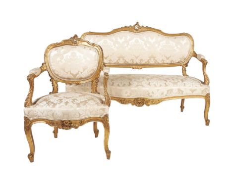 A suite of giltwood seat furniture in Louis XVI style, early 20th century, comprising a set of four side chairs, an armchair,