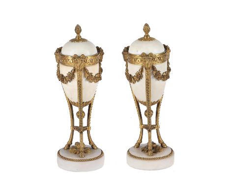 A pair of gilt-bronze and white marble mounted cassolettes in Louis XVI style, 19th century, the domed covers each enclosing 