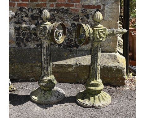 A pair of stone composition exterior light fitments or brackets, 20th century, each with lobed finial and fluted shaft, desce