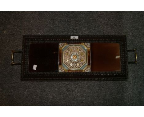 A SHAPLAND & PETTER TILED BREAKFAST TRAY, the central tile having flower motifs, with carrying handles to sides, circa 1900, 