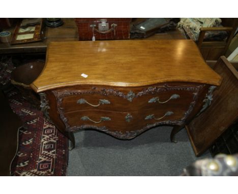 A FRENCH STYLE SERPENTINE COMMODE fitted two drawers, 81cm high, 115cm wide