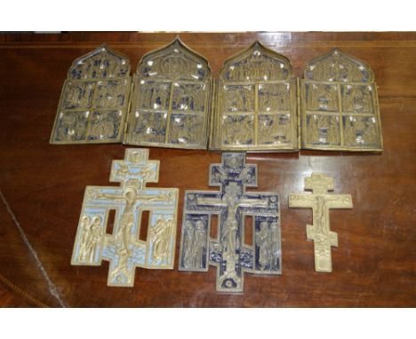 A FOLDING BRASS AND ENAMEL TABLE TOP ICON with scenes from The Stations of the Cross and three other brass and enamel crosses