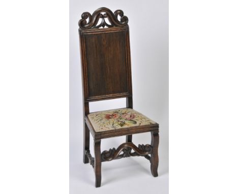 A 17TH CENTURY STYLE OAK PANEL BACK SIDE CHAIR with upholstered seat