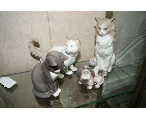 TWO NAO PORCELAIN CATS the largest 17cm in height together with a Royal Copenhagen dog and a Royal Copenhagen cat (4)