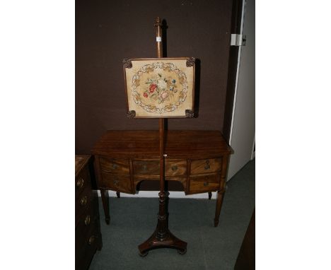 A VICTORIAN ROSEWOOD FRAMED POLE SCREEN with Berlin woolwork panel