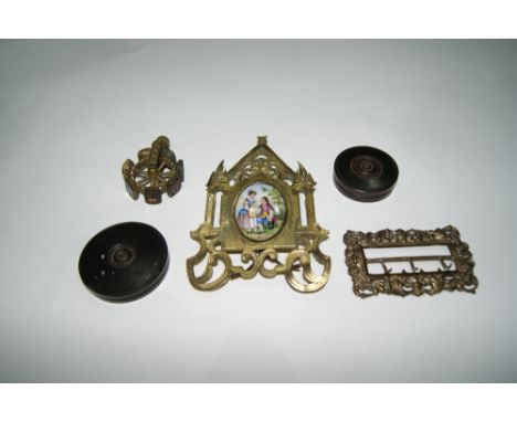 A GILT METAL FRAME with enamel inset plaque, a 19th Century Catherine wheel seal, two treen boxes containing red wax impressi