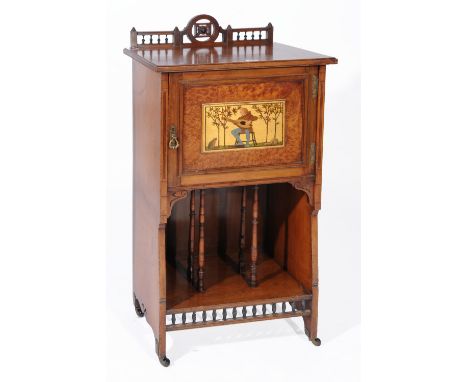 A HEALS WALNUT MUSIC CABINET, the top section having cupboard door with a painted panel of a man playing a lute to a frog and