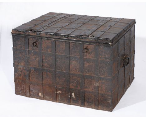 A 19TH CENTURY IRON RECTANGULAR TRUNK with banded top, front and sides, 78cm across