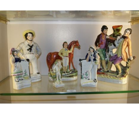 A STAFFORDSHIRE POTTERY MODEL HORSE with groom 23cm, a Staffordshire spill holder with hunting figures, a pair of Staffordshi