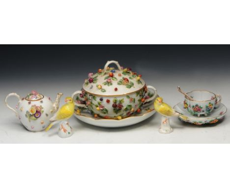 A MEISSEN PORCELAIN OVOID TEAPOT encrusted with flowers, a Meissen porcelain two handled tureen cover and stand, a Meissen po