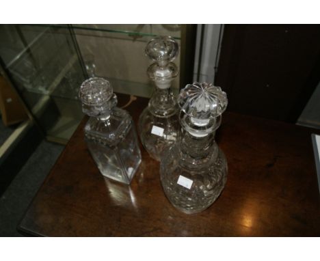 TWO 19TH CENTURY GLASS DECANTERS and one other brandy decanter, circa 1830 (3)