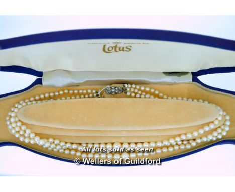 *Vintage three row Lotus pearl necklace with silver marcasite clasp, boxed (Lot subject to VAT)