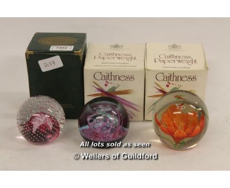 Two boxed Caithness paperweights: Bewitched and Cauldron; a further unsigned paperweight.