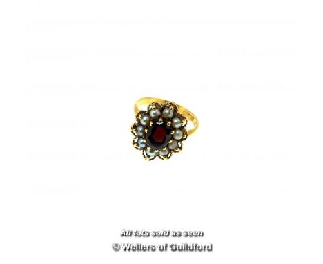 *Antique garnet and seed pearl cluster ring, oval cut garnet with a surround of seed pearls and a twist rope design border, m