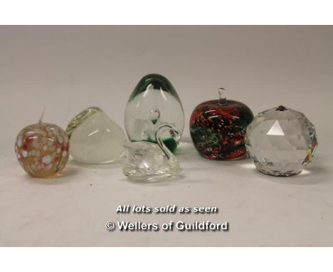 Caithness Pebble paperweight; Swarovski faceted paperweight; Swarovski swan; Isle of Wight glass paperweight and two further 