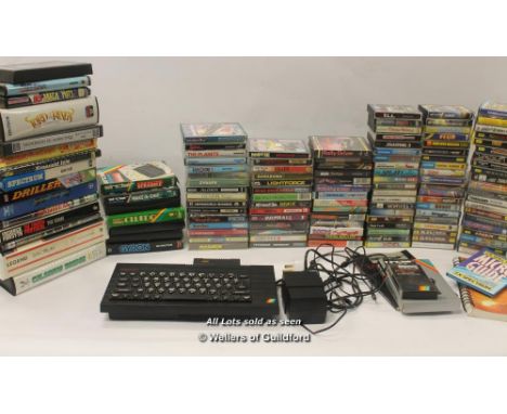 Retro Gaming: a Sinclair ZX Spectrum console, instruction manual and software with a huge collection of over 120 games