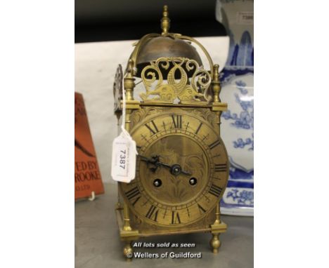 *A French brass lantern clock, brass dial with Roman numerals and two train movement, the back plate stamped Made in France 6