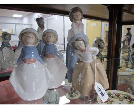 Four Nao Figurines of Girls.