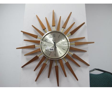 Forestville Red Painted Tin Cased Wall Clock, 39cm diameter. Anstey Wilson sunburst wall clock having Burma teak extremities.