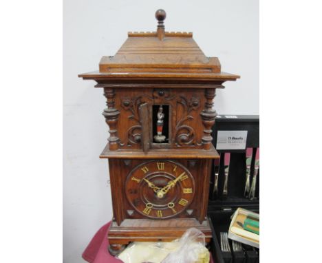 A Late XIX Century Oak Cased Mantle Clock, probably Bavarian with soldier automation behind door to upper section 'GHSF' eigh