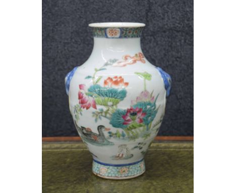 Good Chinese famille rose baluster vase,&nbsp;with moulded mask faux ring handles, decorated with ducks in a garden with flow