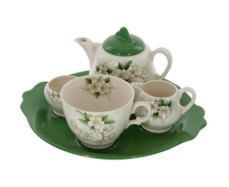 Royal Staffordshire by Clarice Cliff bachelor tea set on stand, painted with apple blossom on a green ground, the stand 9.5" 