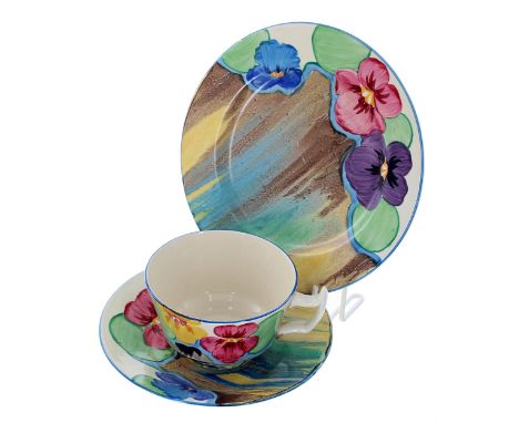 Clarice Cliff Bizarre 'Delecia Pansies' trio, comprising a cup, saucer and side plate, inscribed 'Pansies' to the underside, 