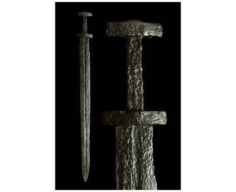 Ca. 900-1100 AD. Viking. A beautifully preserved iron sword with a double-edged bevelled and pointed blade and wide shallow g