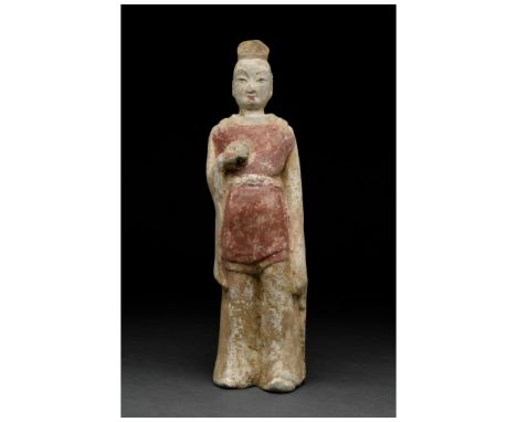 Ca. 500 AD. Chinese Northern Wei Dynasty. A carefully crafted male attendant figure dressed in a red tunic and cream-coloured