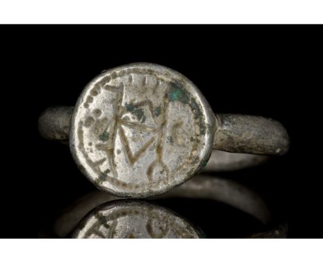 Ca. 1100-1400 AD. Medieval Western Europe. A beautiful silver ring comprising thin circular band and an applied oval bezel fe