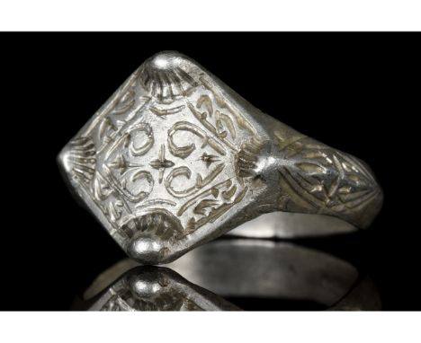 Ca. 900-1100 AD. Viking Age. A beautifully decorated silver ring comprising a circular hoop, flared shoulders with linear dec