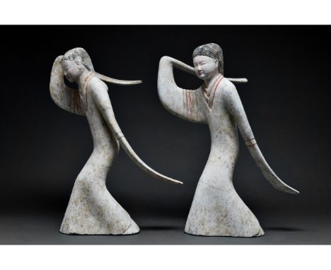 Ca. 202 BC-220 AD. Han Dynasty. Two large grey earthenware figures of dancers. The elegant clothing comprises flowing, long-s