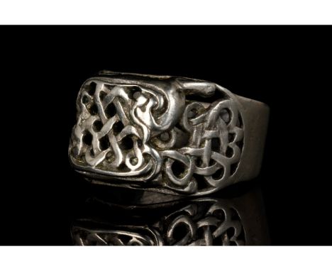 Ca. 1850-1900 AD. European. A beautiful Viking-style silver ring with a thick circular band and an interwoven open work bezel