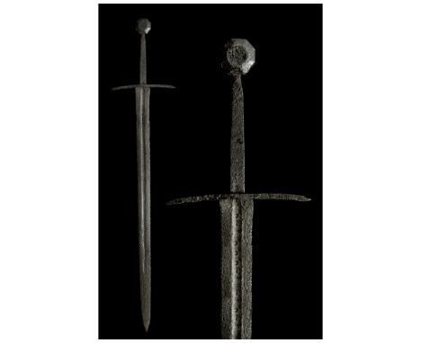 Ca. 1250-1350 AD. Medieval Western Europe. A stunning, forged-iron long sword of the Oakeshott Type XIIa.4 with a long hilt a
