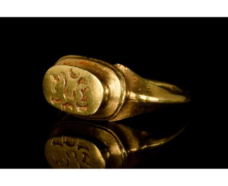 Ca. 1000-1300 AD. Holy Lands. A beautiful Crusaders or Seljuk gold ring with a circular hoop, flared shoulders with central r