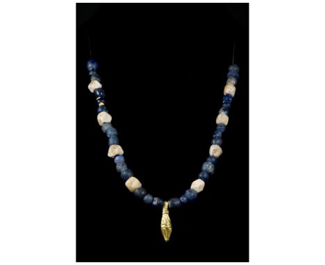 Ca. 100-300 AD. Roman. A beautiful restrung and fully wearable necklace made of a single string of white and blue glass circu