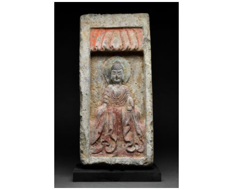 Ca. 386-534/535 AD. Northern Wei Dynasty. A terracotta tile featuring a beautiful depiction of a seated Buddha wearing garmen